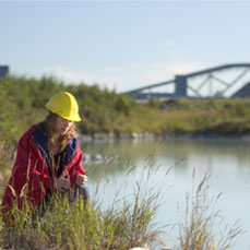 Environmental coordinator sampling the water reservoir