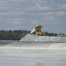 Truck dumping near the tailing management facility